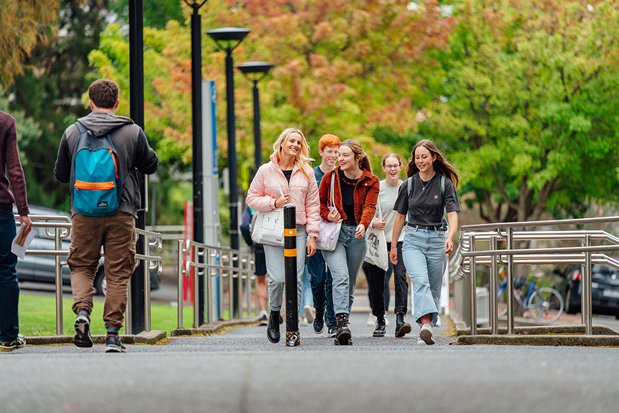 A group of UTAS students walking along on campus