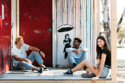 Friends hanging out on a balcony